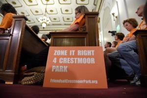 DENVER, CO - JUNE 08: Crestmoor neighborhood residents gathered in large numbers during a city council meeting to discuss a proposed rezoning of a church property to make room for an apartment complex near Crestmoor Park. City council heard from the community regarding the rezoning, which was largely opposed to by residents in matching orange shirts reading, "Rezone it Right 4 Crestmoor Park," on Monday, June 8, 2015. (Photo by AAron Ontiveroz/The Denver Post)