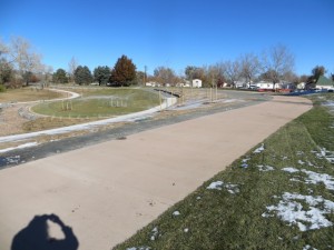 This is the bike path relocated to the rear, east side, of the park. The Park is sodded, seeded, and bushes and trees are in the ground.